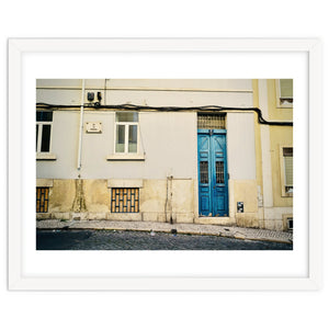 Lisbon Blue door on the street by KISSA STUDIO
