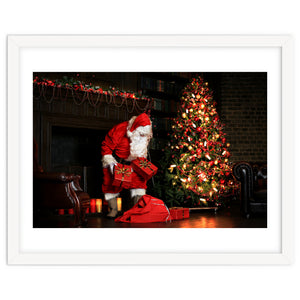 Santa Claus put his Christmas gift under the Xmas tree at midnight by Julien