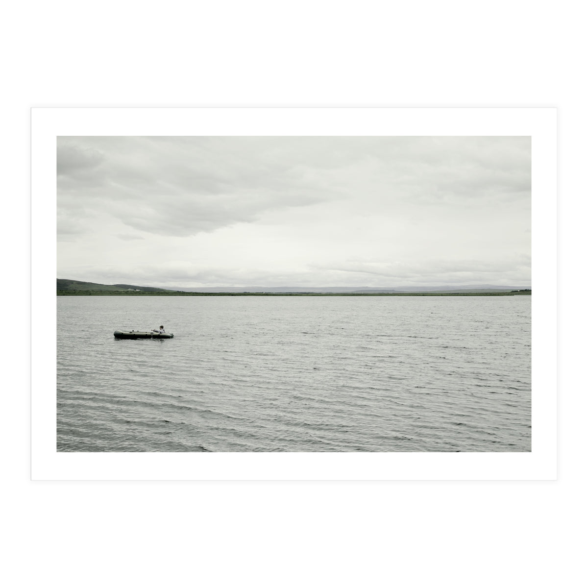 A boy pedaling the Board on the Lake - Iceland (Print Only)