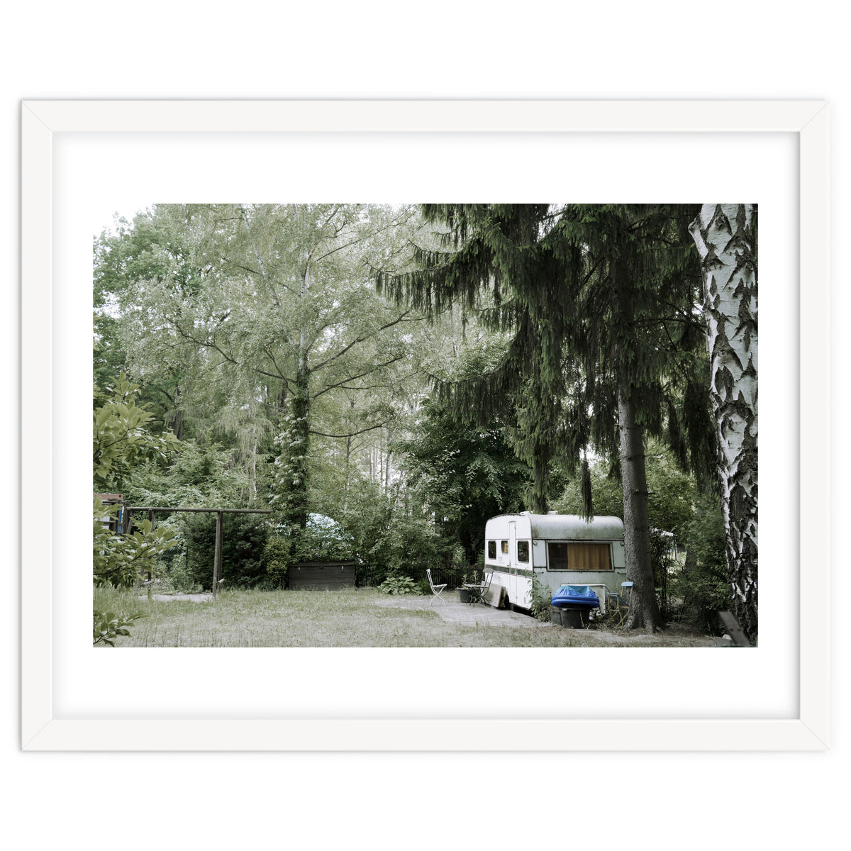 Travel trailer in the green garden