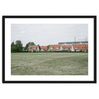 Red roof houses in the green field