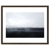 Tourists on the black sand beach - Iceland