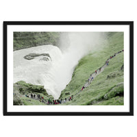 Tourists walking around the waterfall - Iceland