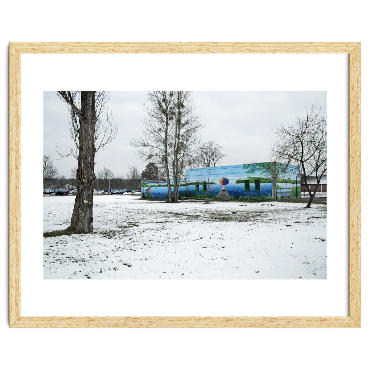 Colorful barn in the snowy ground landscape