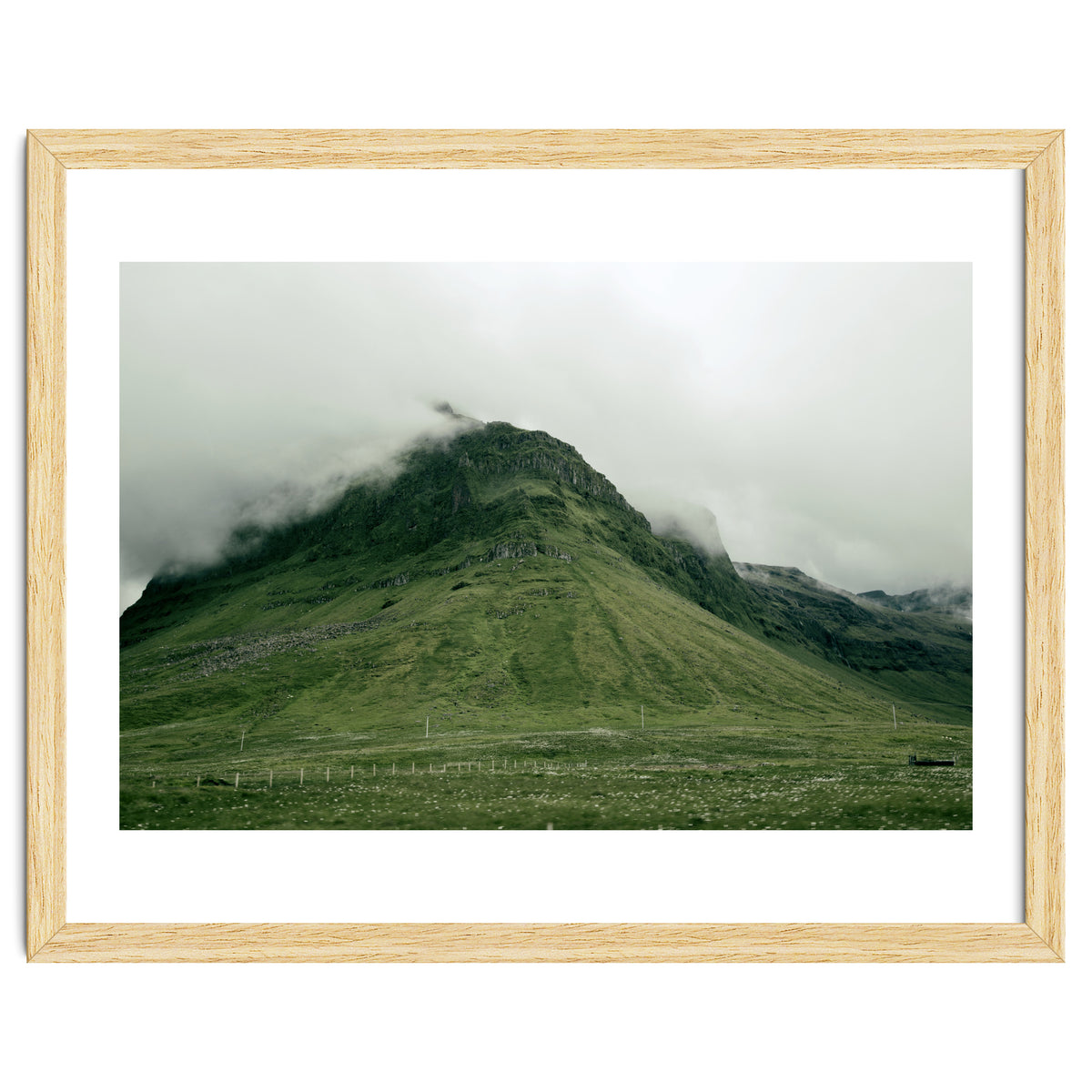 Green mountain covered in clouds - Iceland