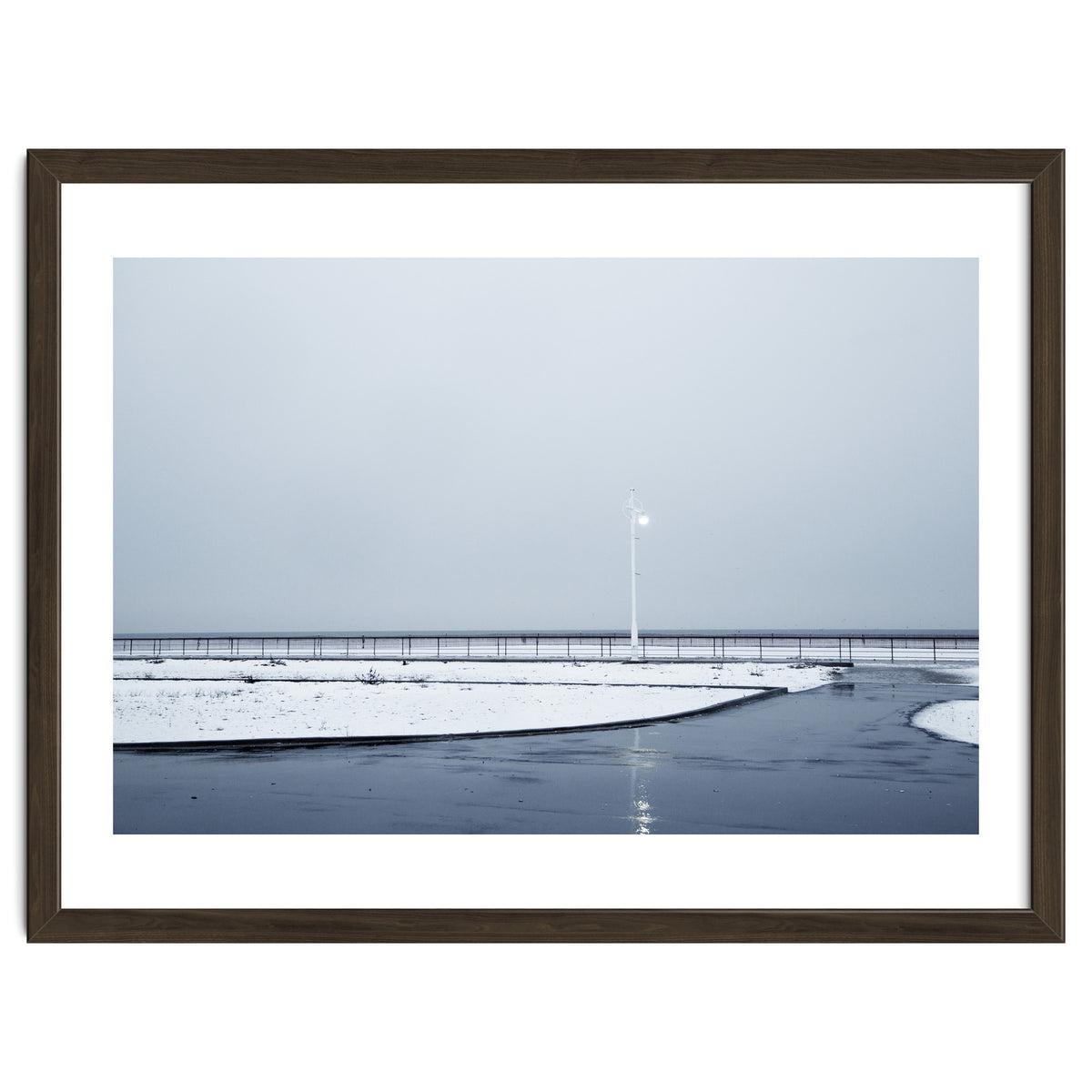 Street light turned on the winter snow street