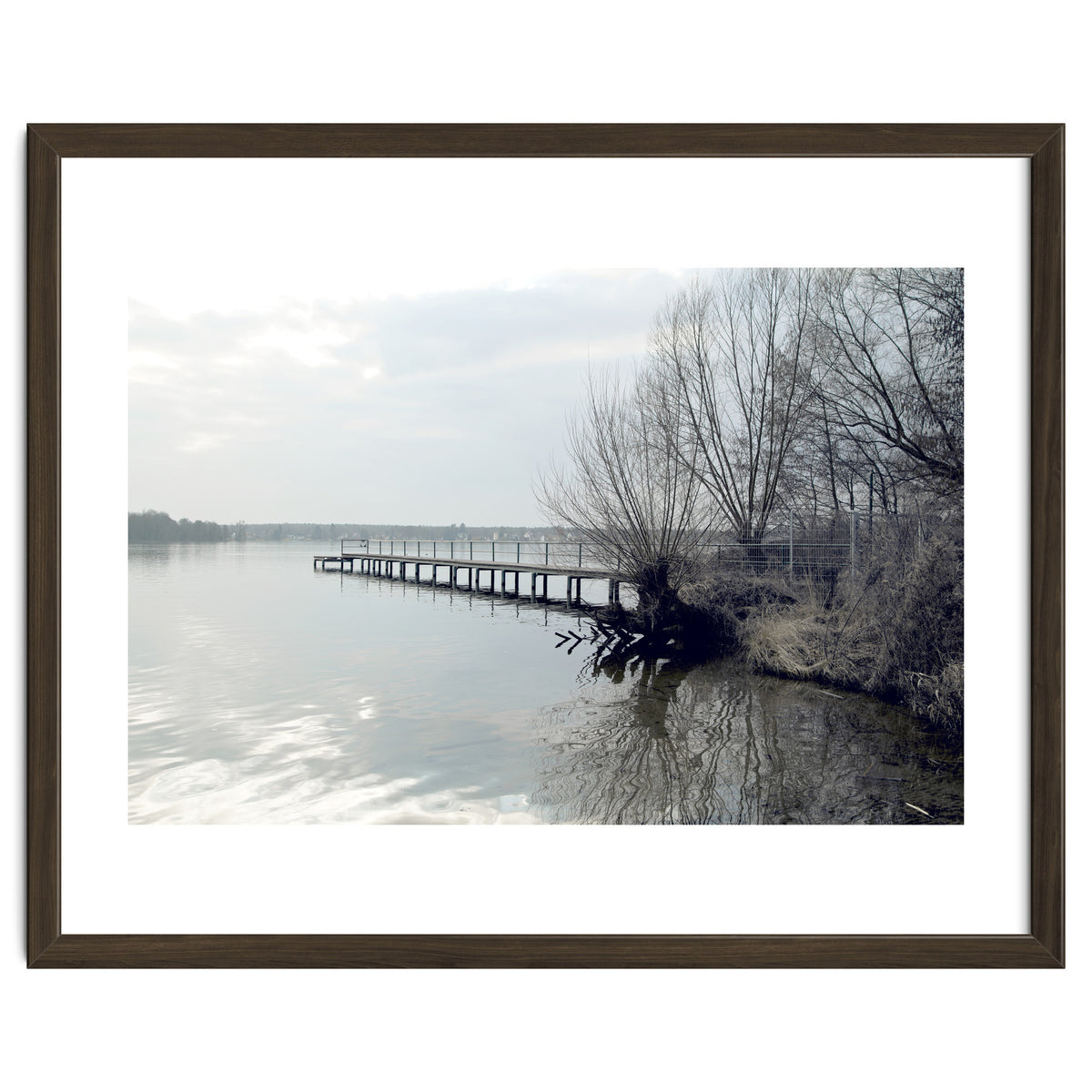 Sunny day pier in the lake