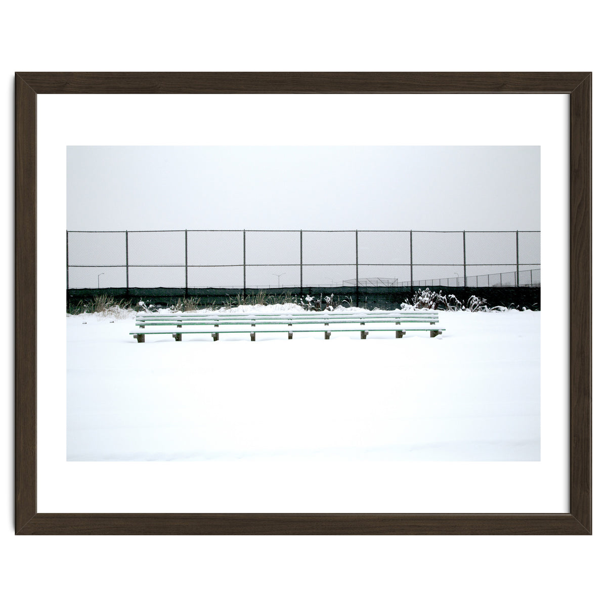 Bench with no people in snowy winter