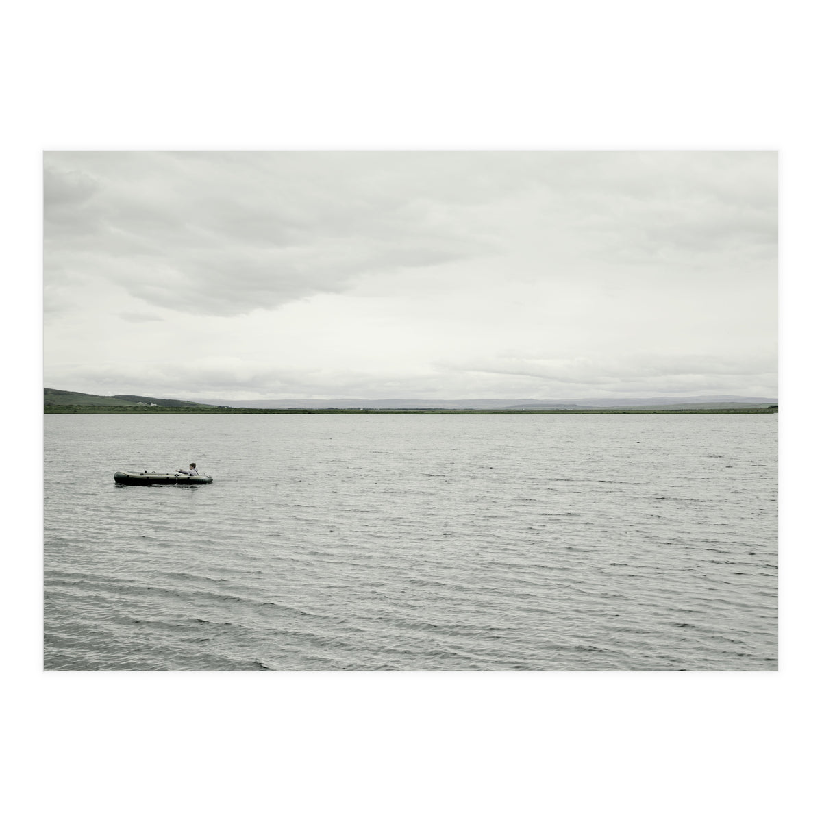 A boy pedaling the Board on the Lake - Iceland (Print Only)