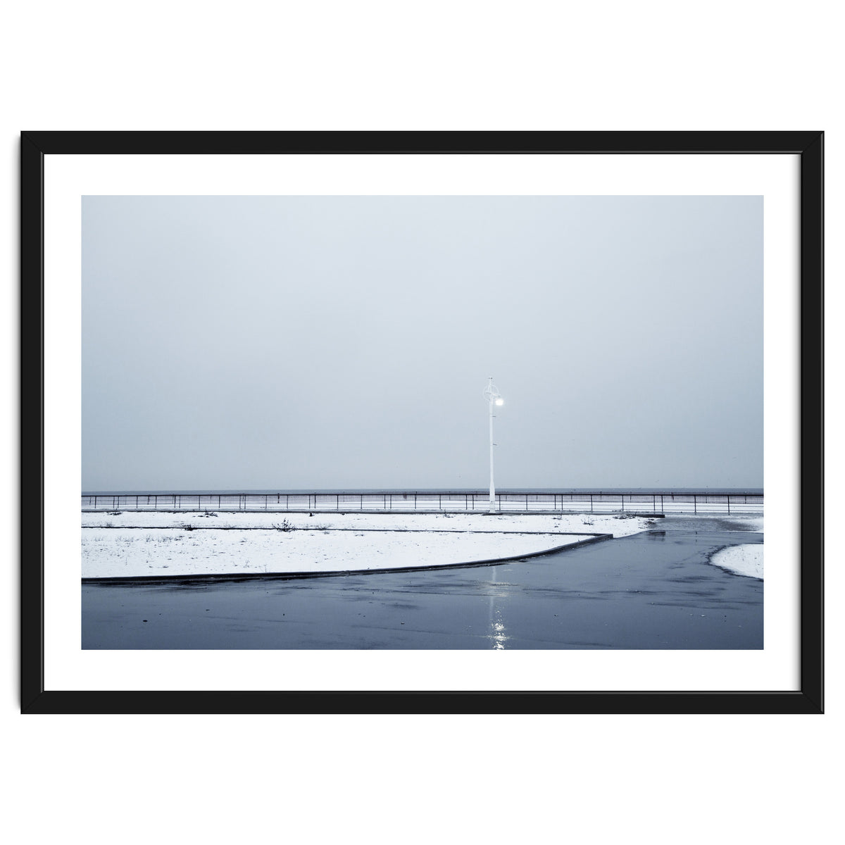 Street light turned on the winter snow street