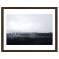 Tourists on the black sand beach - Iceland