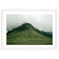 Green mountain covered in clouds - Iceland