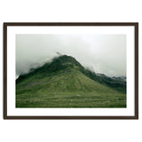 Green mountain covered in clouds - Iceland thumbnail