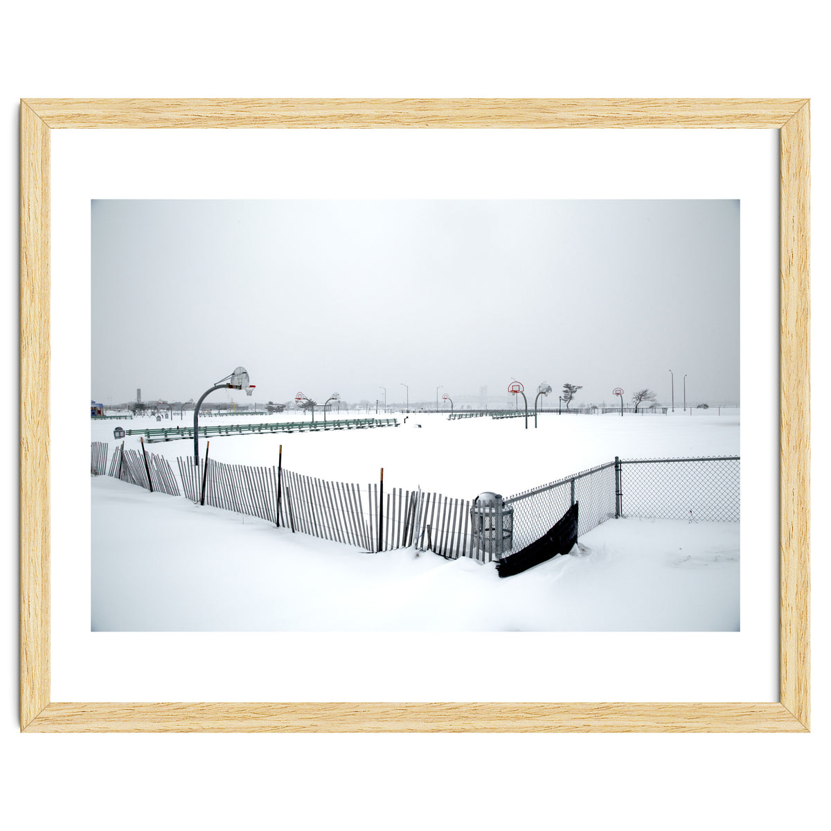 Snow-covered deserted basketball court in winter