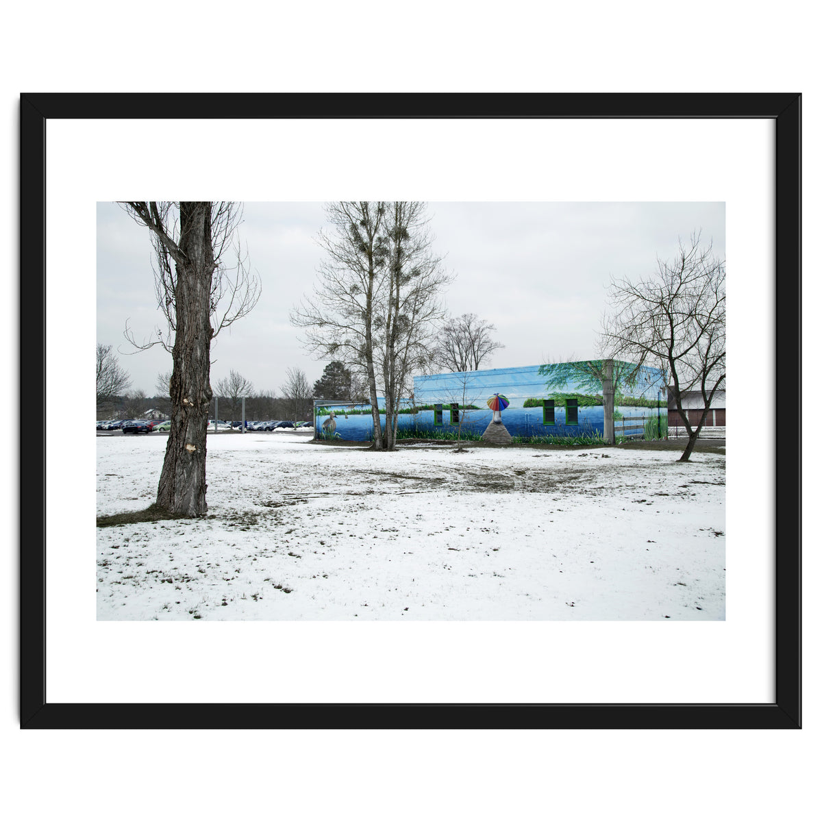 Colorful barn in the snowy ground landscape