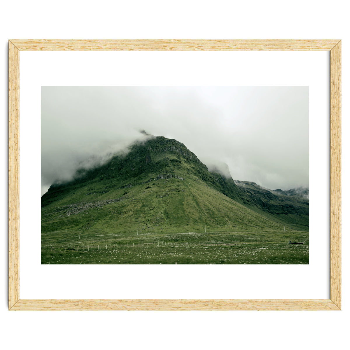 Green mountain covered in clouds - Iceland