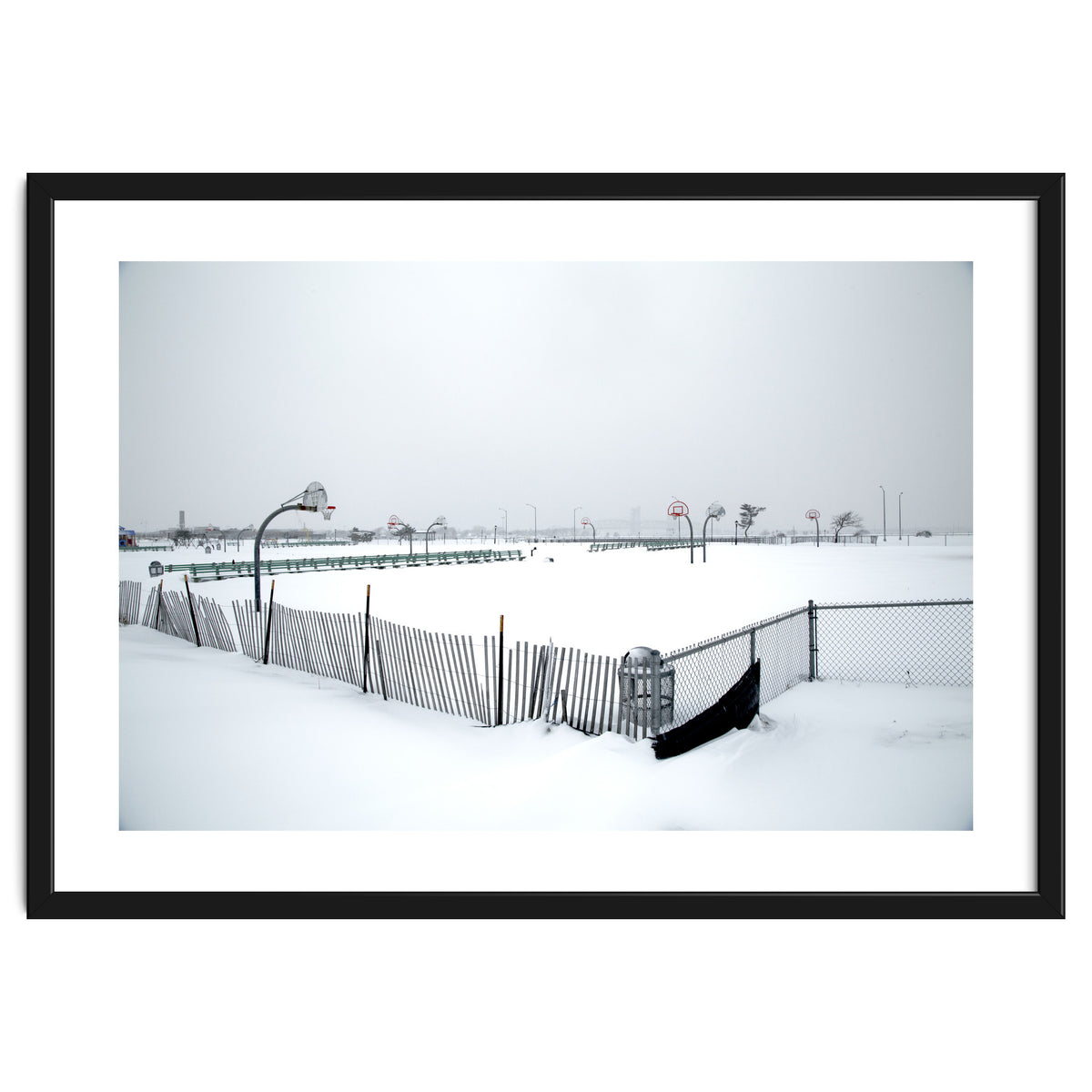 Snow-covered deserted basketball court in winter