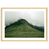 Green mountain covered in clouds - Iceland thumbnail