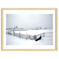 Snow-covered deserted basketball court in winter