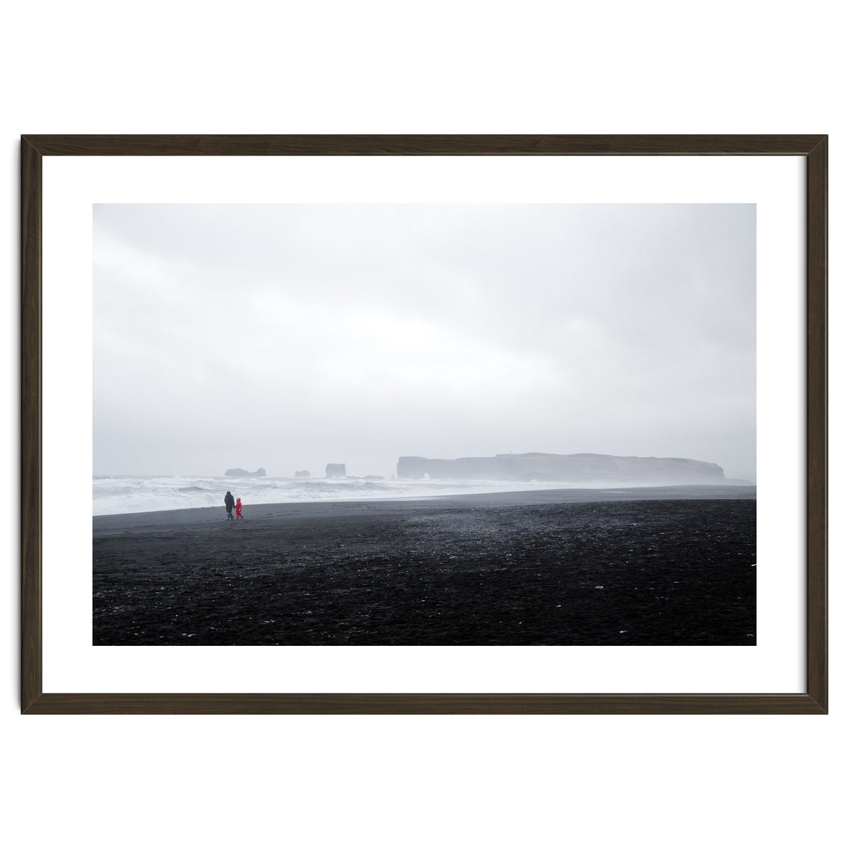 Family walking on the black sand beach - Iceland
