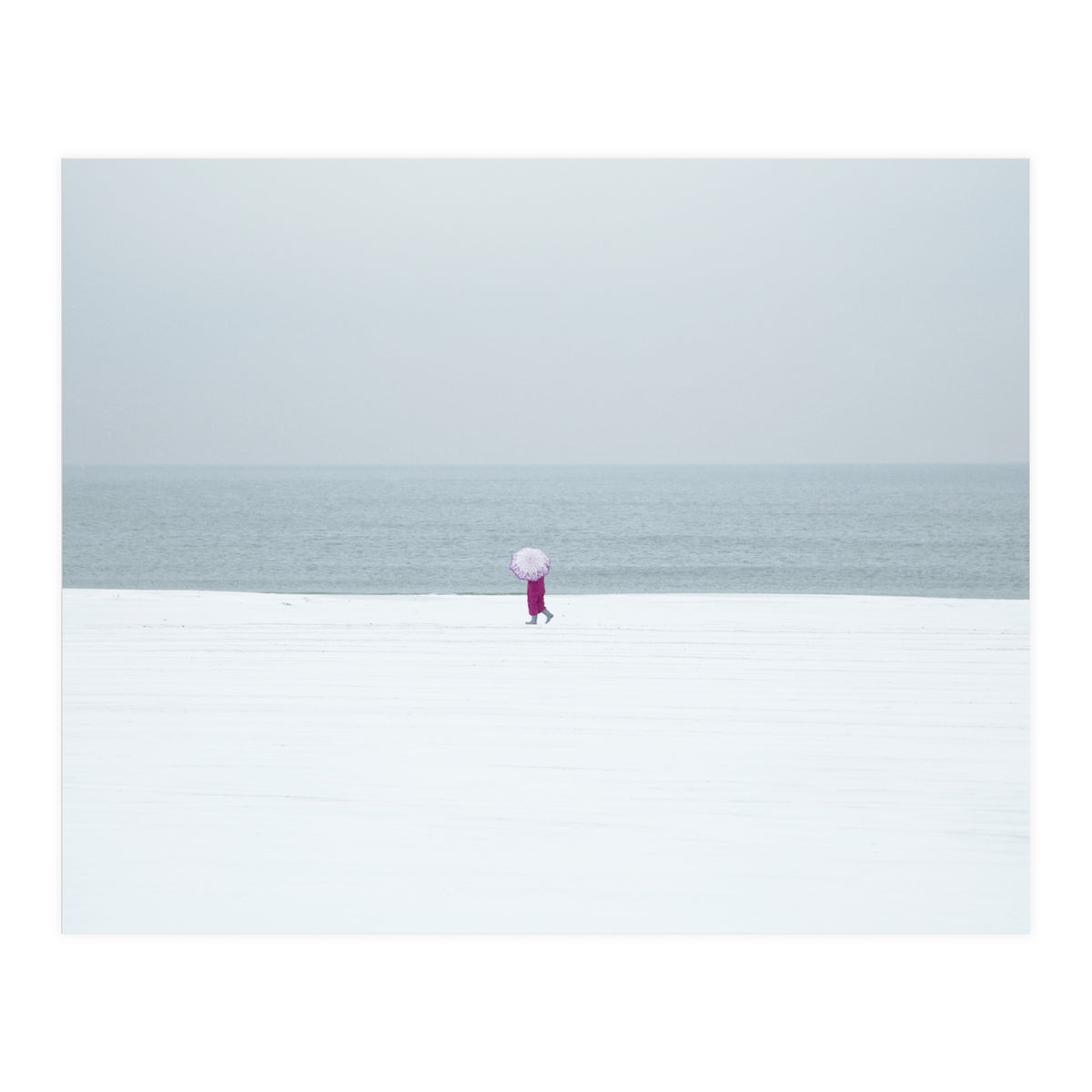 A walking woman in the winter snow beach (Print Only)