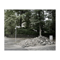 Piled-up rocks under construction on the street (Print Only)