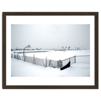 Snow-covered deserted basketball court in winter