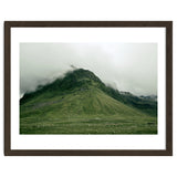 Green mountain covered in clouds - Iceland thumbnail
