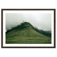 Green mountain covered in clouds - Iceland