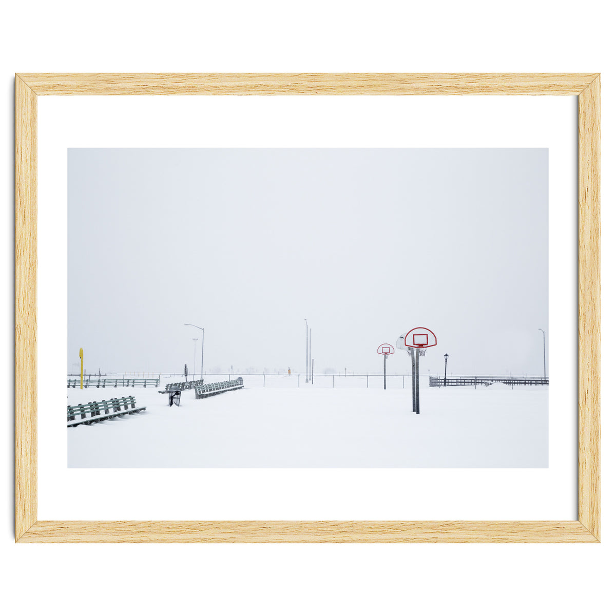 Snow-covered Basketball court and side bench