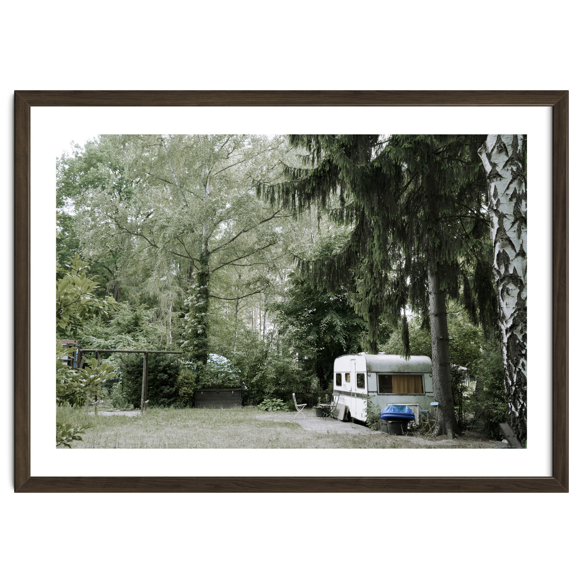 Travel trailer in the green garden