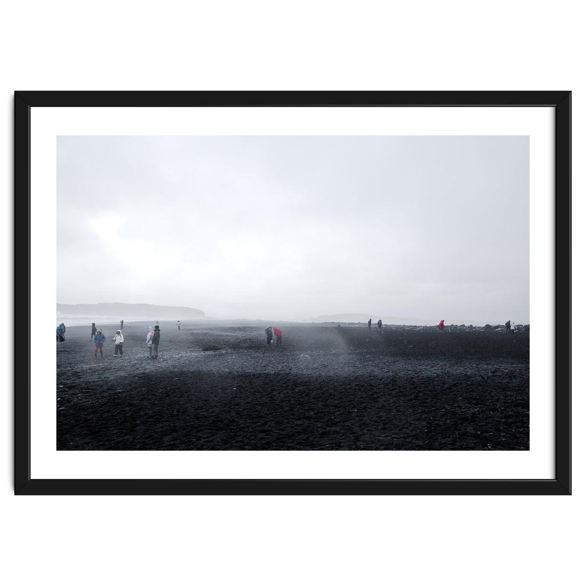 Tourists on the black sand beach - Iceland