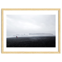 Family walking on the black sand beach - Iceland