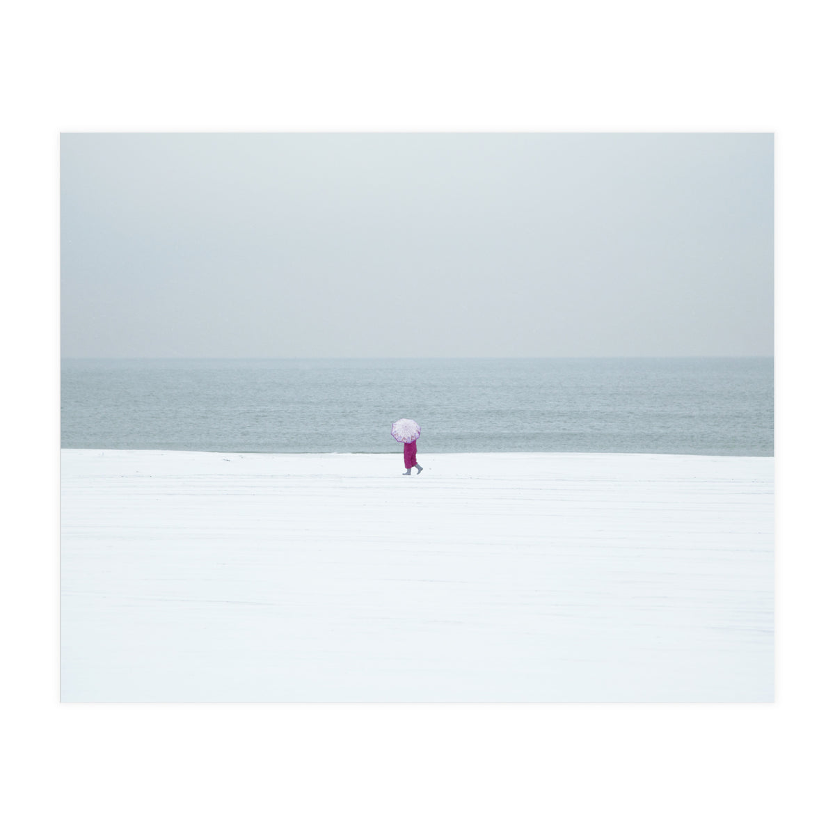 A walking woman in the winter snow beach (Print Only)