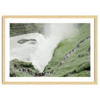 Tourists walking around the waterfall - Iceland