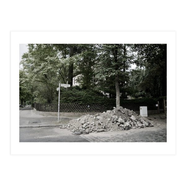 Piled-up rocks under construction on the street (Print Only)