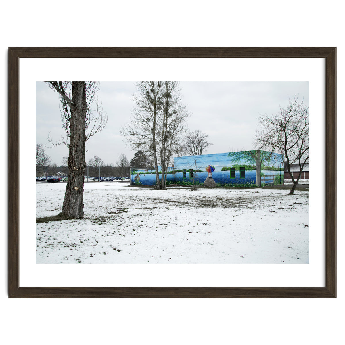 Colorful barn in the snowy ground landscape