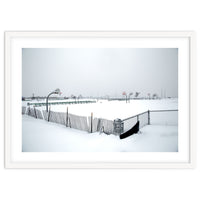 Snow-covered deserted basketball court in winter