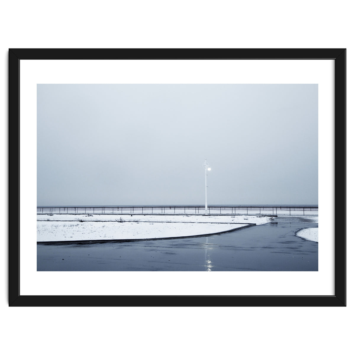 Street light turned on the winter snow street