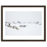 Tables and benches in a snow-covered park thumbnail
