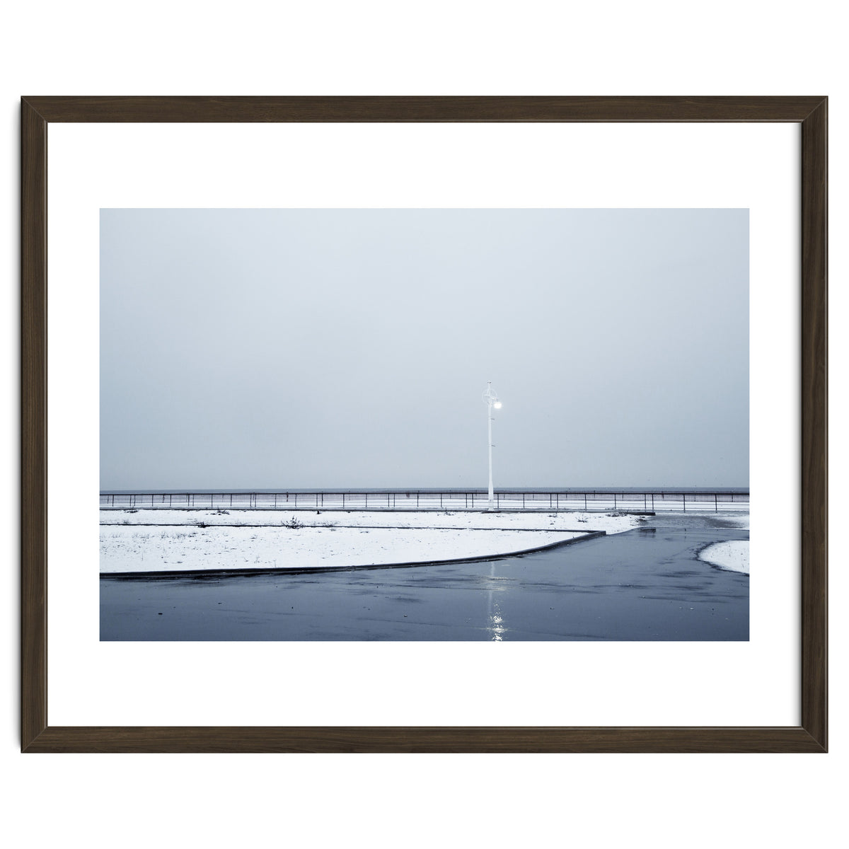 Street light turned on the winter snow street