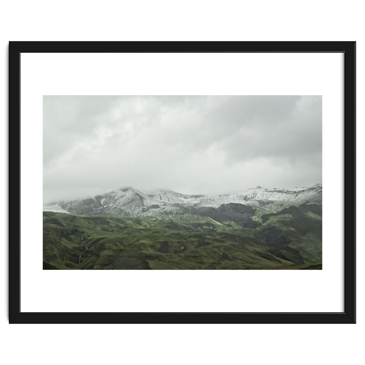 Snow-covered green mountains - Iceland