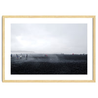 Tourists on the black sand beach - Iceland