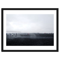 Tourists on the black sand beach - Iceland