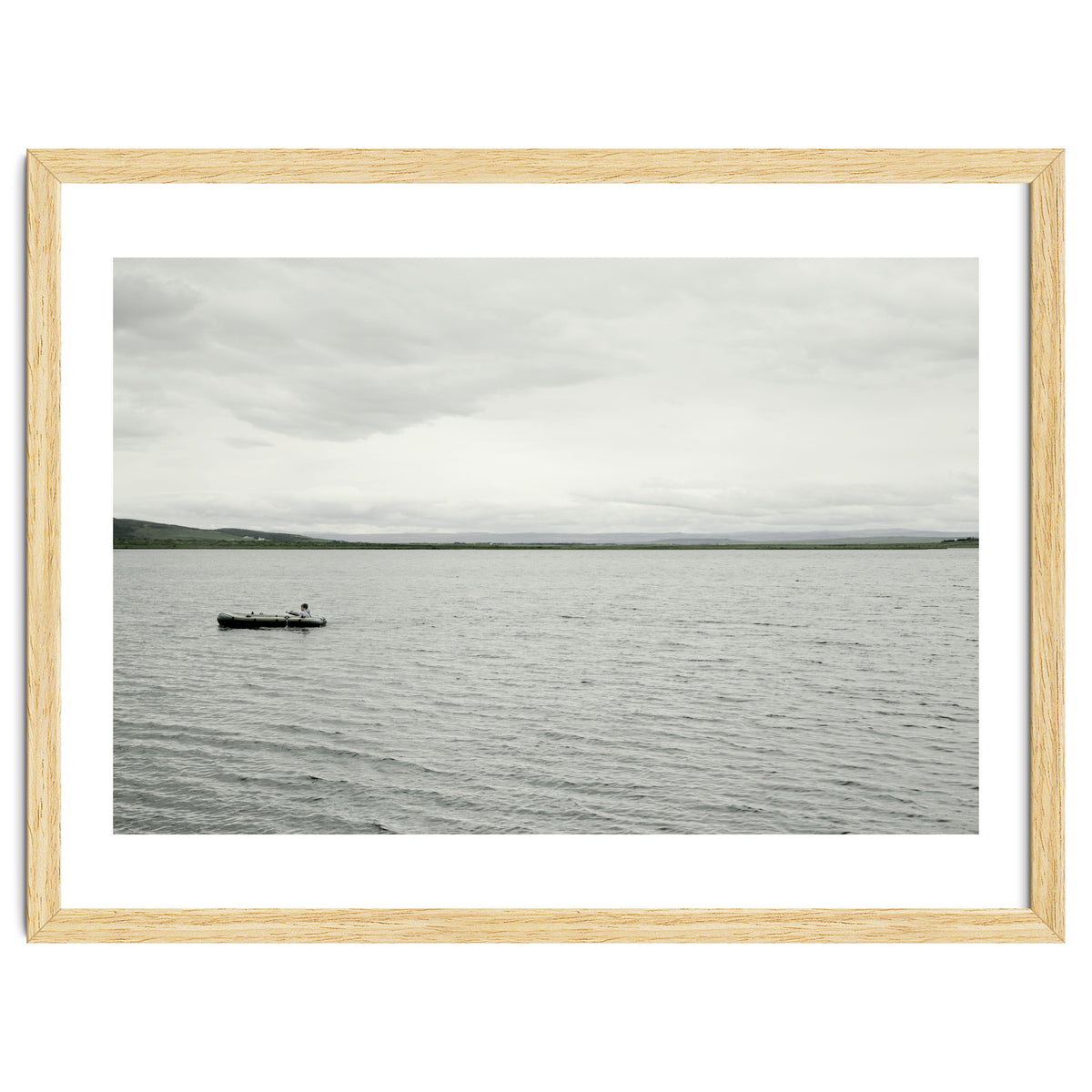 A boy pedaling the Board on the Lake - Iceland