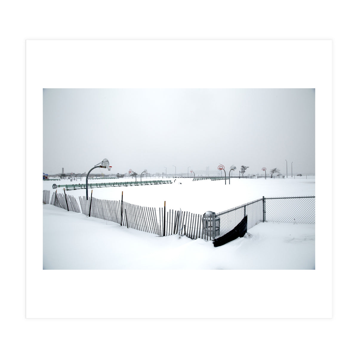 Snow-covered deserted basketball court in winter (Print Only)