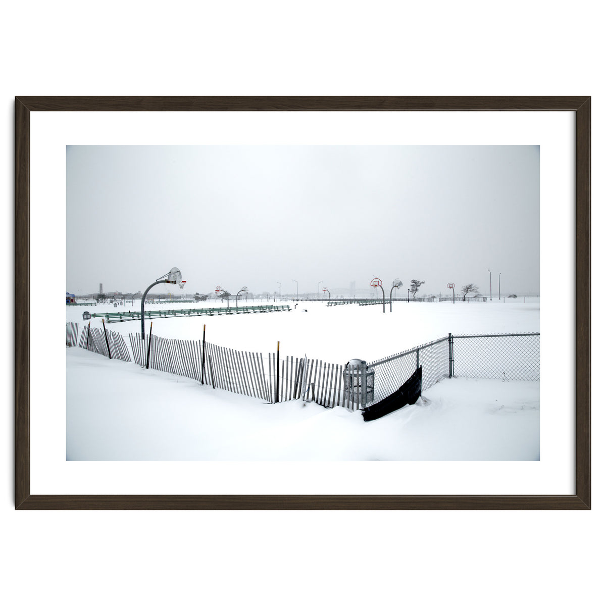 Snow-covered deserted basketball court in winter