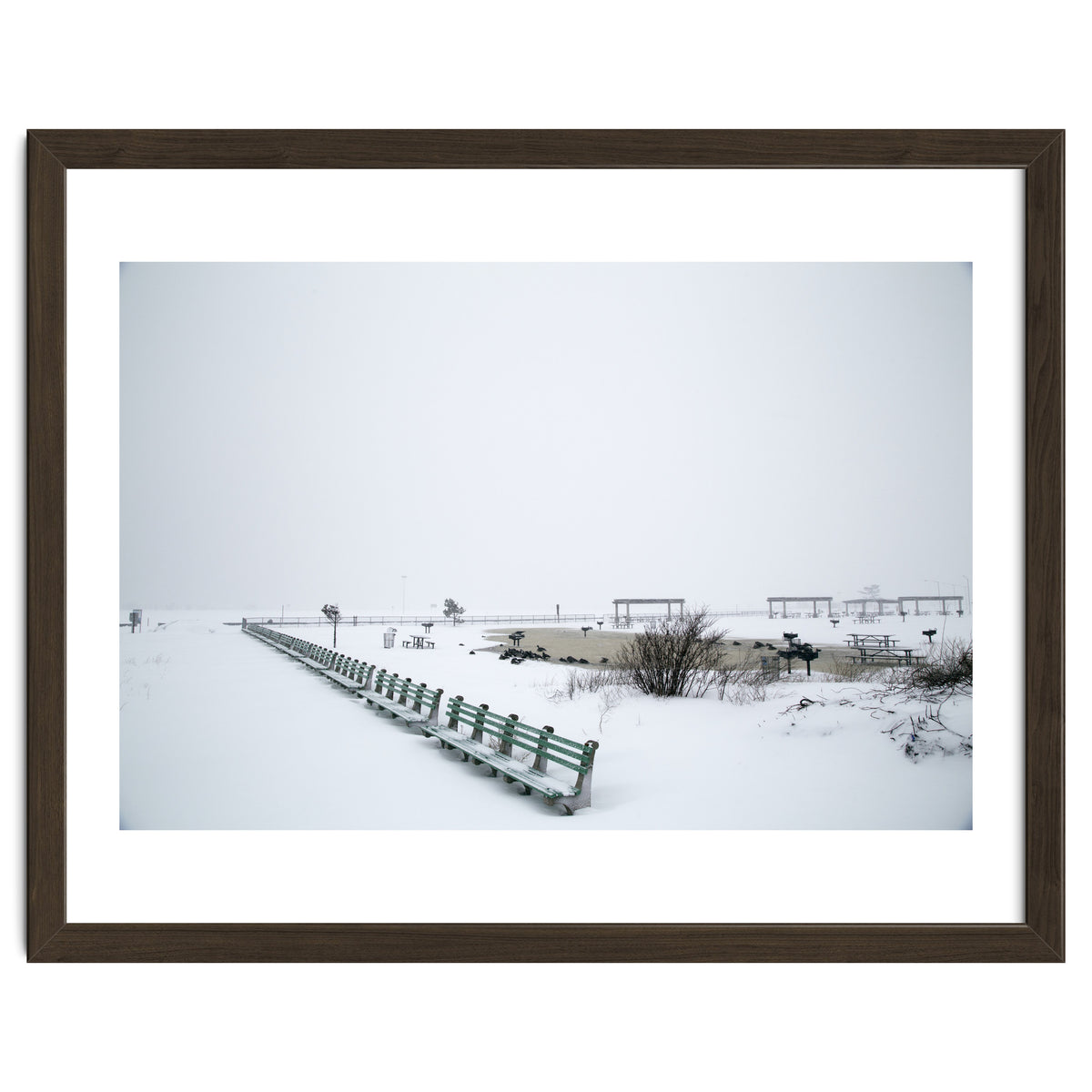 No people on a bench in the snowy winter