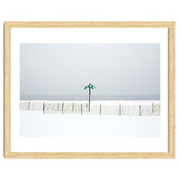 Fake palm tree in the winter snow beach