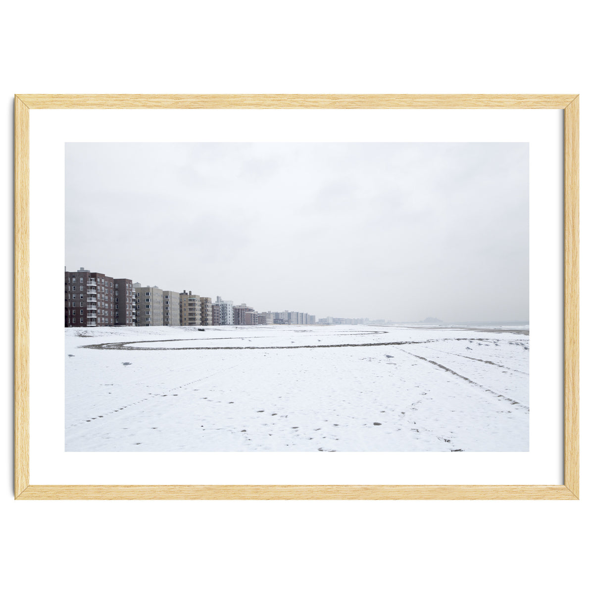 Traces of driving a car on a snowy coast